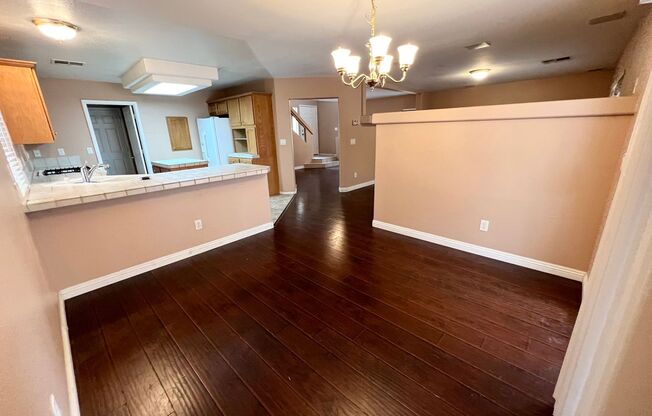 CHARMING HOME AVAILABLE IN SOUTHWEST! HOME HAS LAMINATED HARDWOOD FLOORING, NO CARPETS! KITCHEN HAS BREAKFAST BAR AND ISLAND AND LOTS OF CABINET SPACE! HOME CONTAINS A LOFT UPSTAIRS AND FAMILY ROOM DOWNSTAIRS! BACKYARD PATIO IS COVERED FOR SHADE!