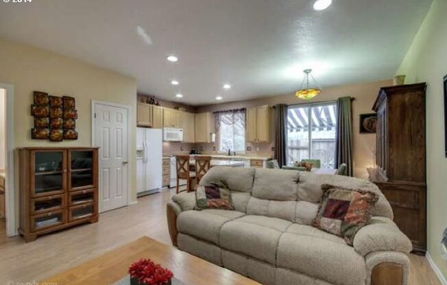 Spacious 3-Bedroom Townhouse with Open Living Areas and Private Patio