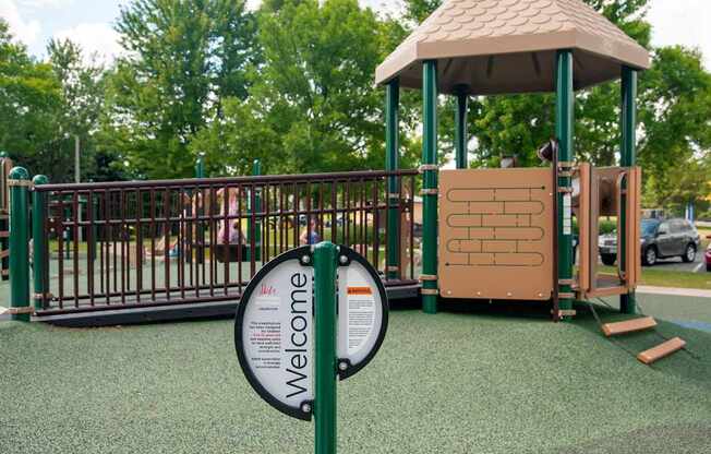 A playground with a sign that says "Welcome".
