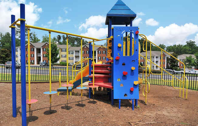 Playground with a park bench looking toward the playground equipment