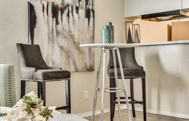 a room filled with furniture and vase of flowers on a table