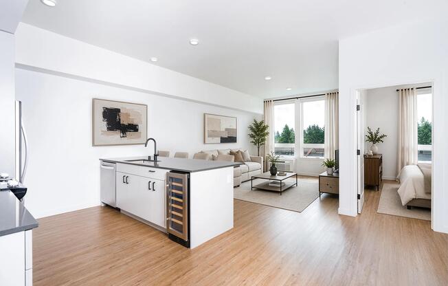 Open-concept living with a spacious kitchen island, integrated wine storage, and seamless flow between dining, lounge, and private bedroom areas.