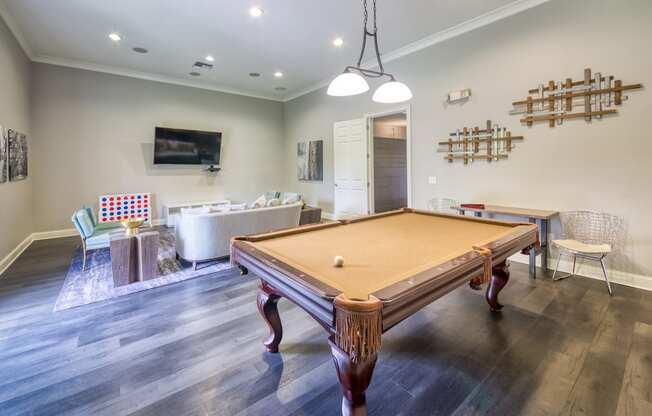 Courtney Station Apartments - Resident clubhouse with billiards table