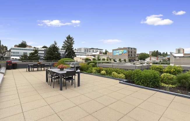 Resident Lounge on the Rooftop with a dining table and chairs at Villaggio Apartment Homes, Tacoma