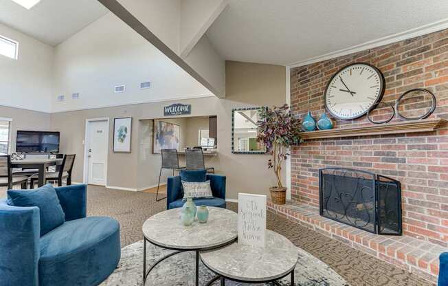 A living room with a fireplace and a clock on the wall.