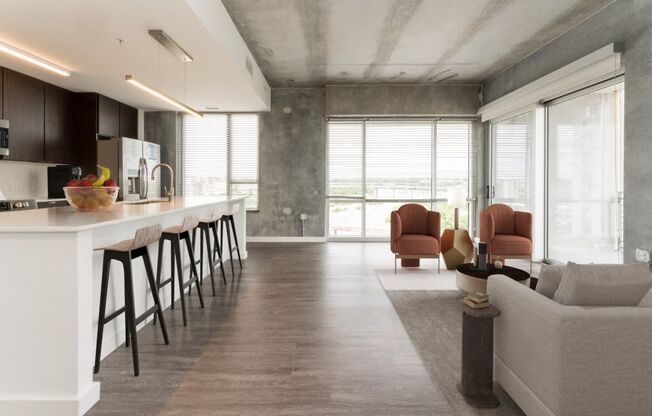 a kitchen and living room in a loft apartment