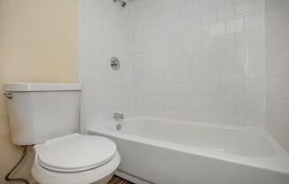 a close up of a sink and a bath tub