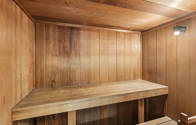 A wooden bench in a wooden room.