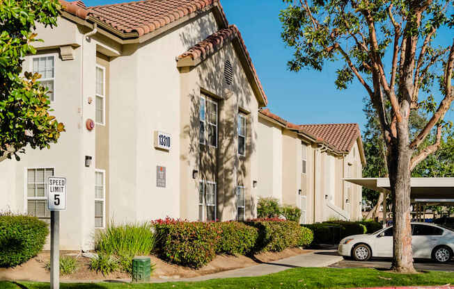 A building with a sign that says "GREED LIMIT 5" in front of it.