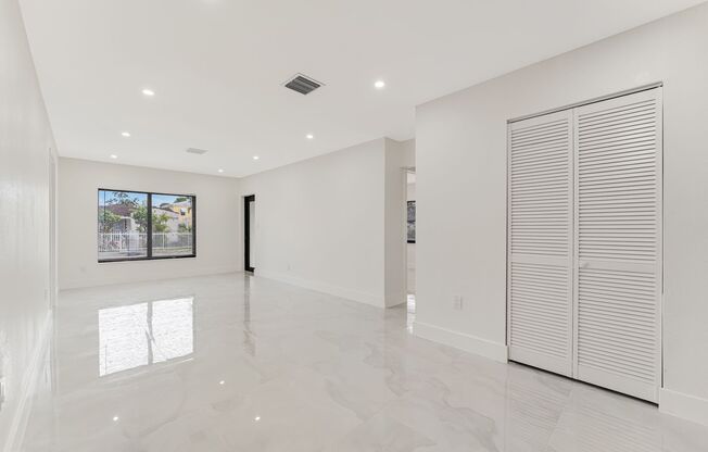 Beautifully renovated 4 bed 2 bath home with a large backyard and parking.