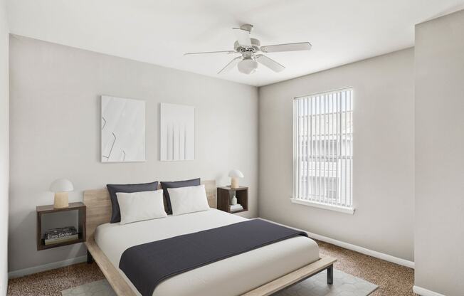 a bedroom with a bed and a ceiling fan at Veranda at Centerfield, Texas, 77070