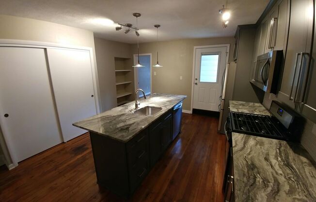 Beautifully renovated gem in South Side. Granite, Stainless, Hardwood Floors, Laundry A/C