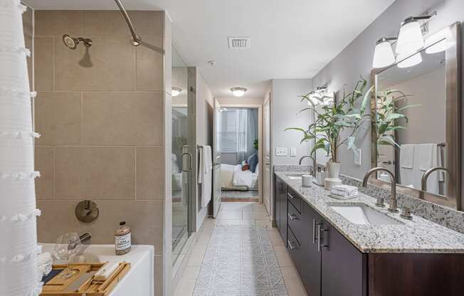 a bathroom with a shower and a sink and a mirror