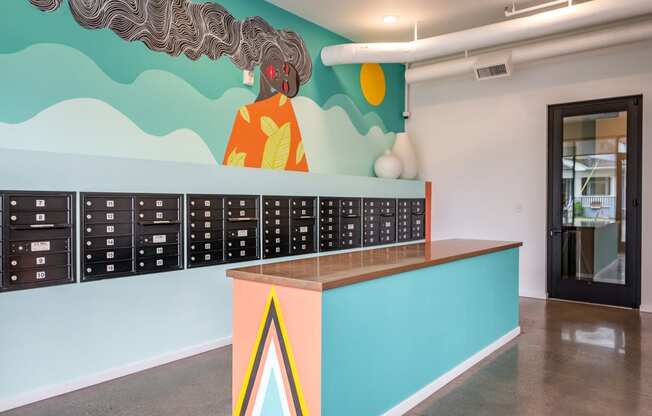 a mural of a woman on the wall behind a desk