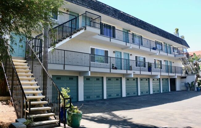 SURFER’S BEACH FLAT w/ IN UNIT LAUNDRY ! ..... tandem GARAGE !!!