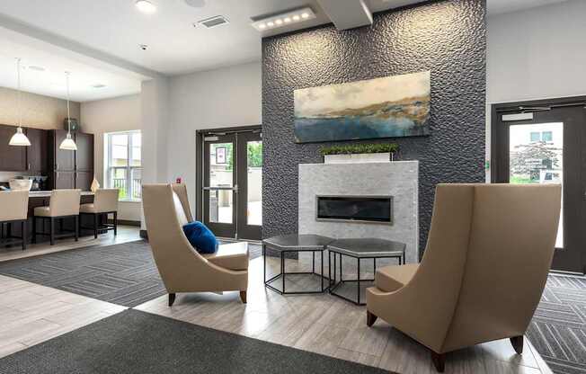 A modern living room with a fireplace and two chairs.