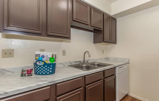 a kitchen with a sink and a microwave