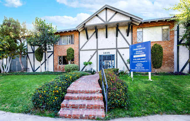 a building with a blue sign in front of it