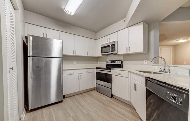 Kitchen with white cabinetry at Pembroke Pines Landings, Pembroke Pines, FL, 33025