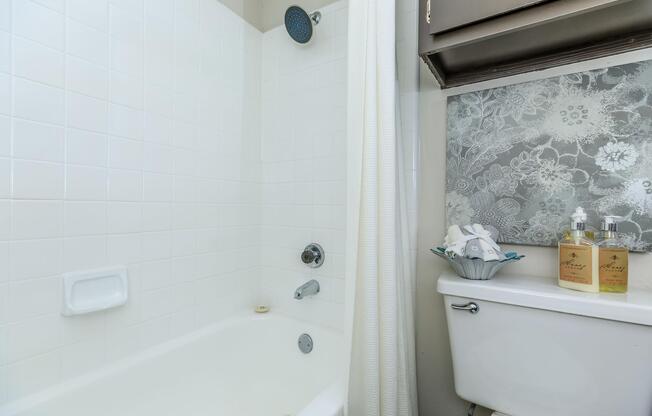furnished bathroom with a white shower curtain