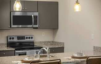 a kitchen with a sink and a microwave