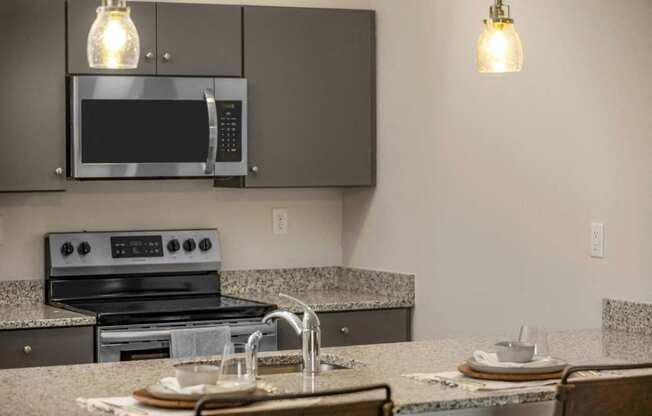 a kitchen with a sink and a microwave