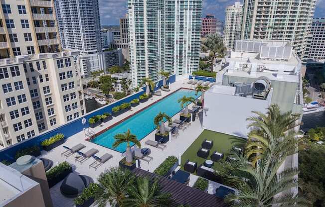Rooftop lap pool with private cabanas and day beds