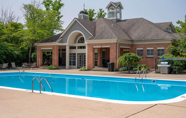 a swimming pool in front of a house