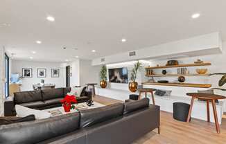 a living room with white walls and hardwood flooring