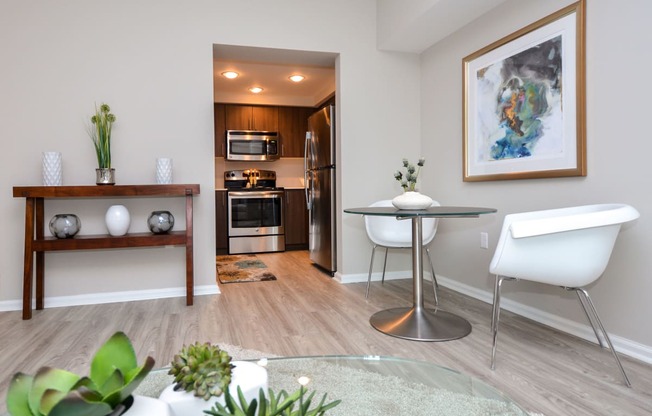 a living room with a dining room and a kitchen at Apartments at Denver Place, Colorado