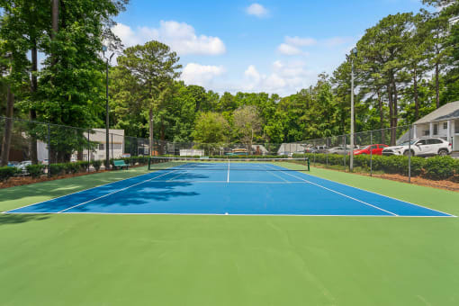 the tennis court at the estates apartments