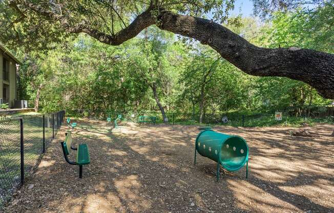 a picnic area with benches and a tree at South Lamar Village, Austin, TX