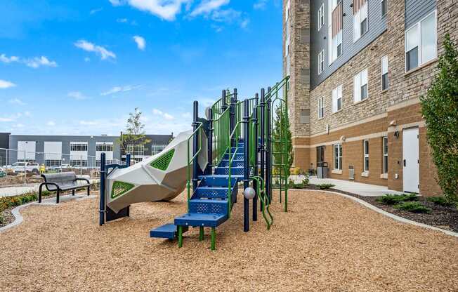 A playground with a slide, swings, and a climbing frame.