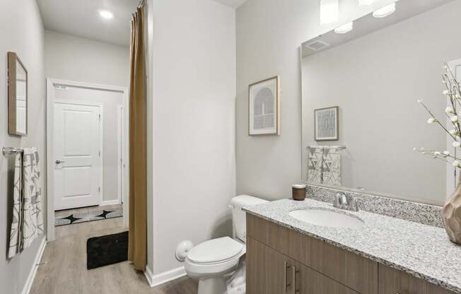 a spacious bathroom with a tub and walk-in closet