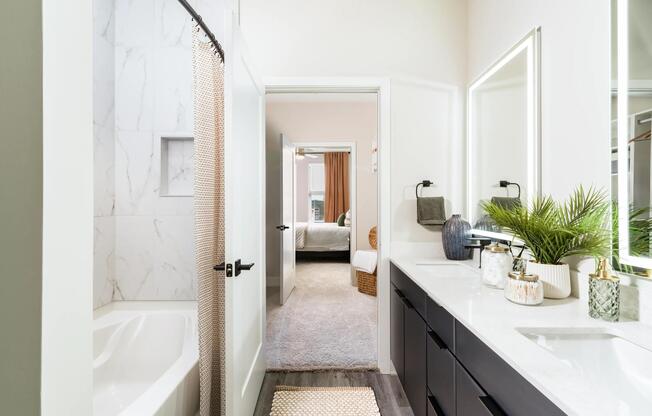 A premium primary bath with a double vanity, clean-lined finishes, and a walk-in shower designed for everyday routines and easy mornings.