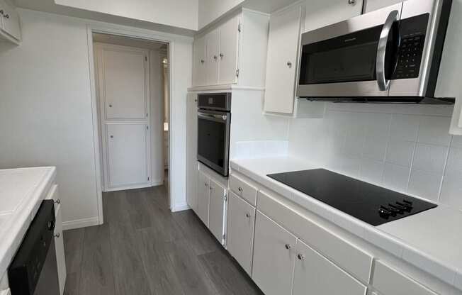 Kitchen with Stainless Steel Appliances and White Cabinets