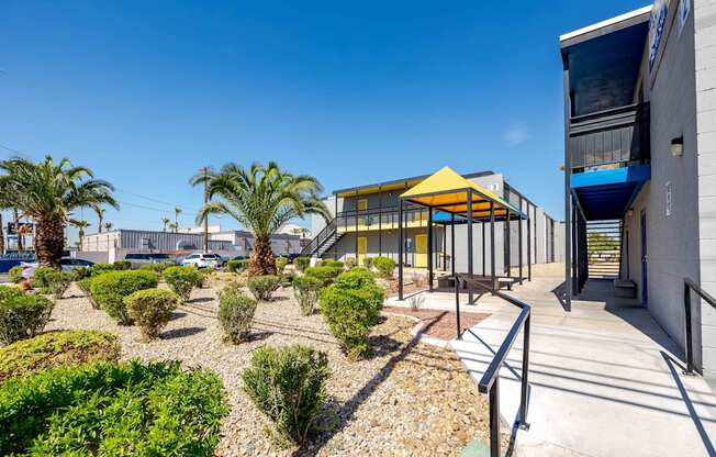 a building with a courtyard with palm trees