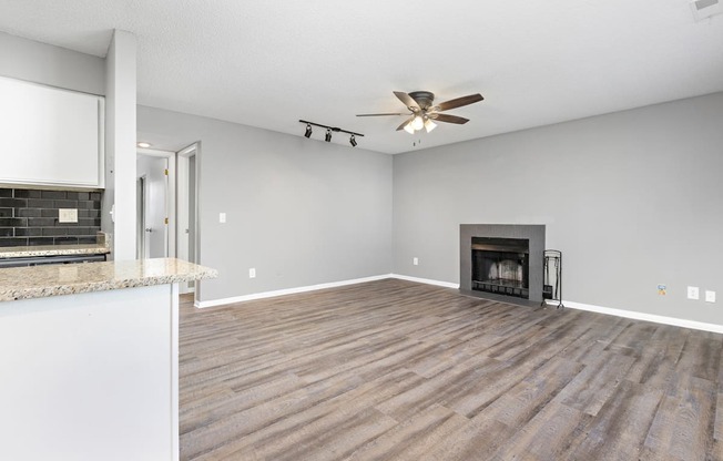 Living room with fireplace at Eddingham in Lawrence, KS