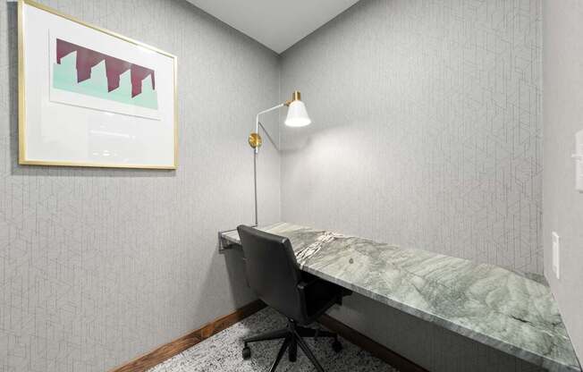 A room with a desk and a chair.