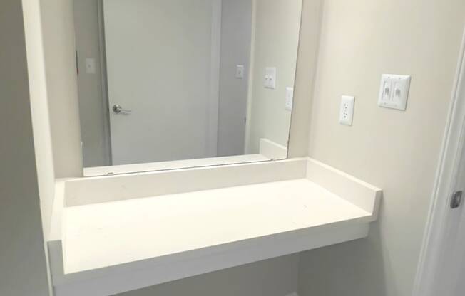 Vanity with mirror and lighting  at Huntington Apartments, Morrisville, 27560