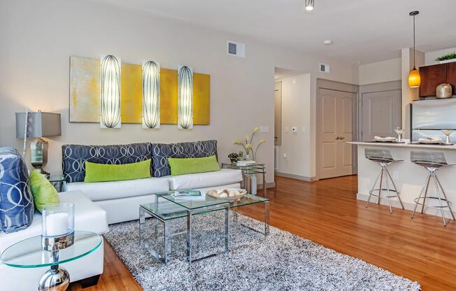 a living room filled with furniture and a flat screen tv