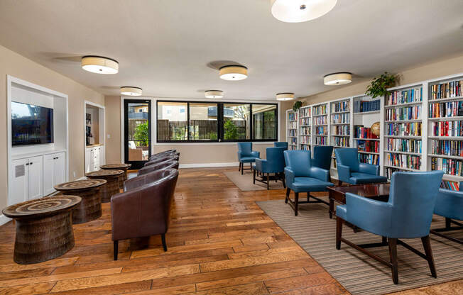 the library at the community center with chairs and tables