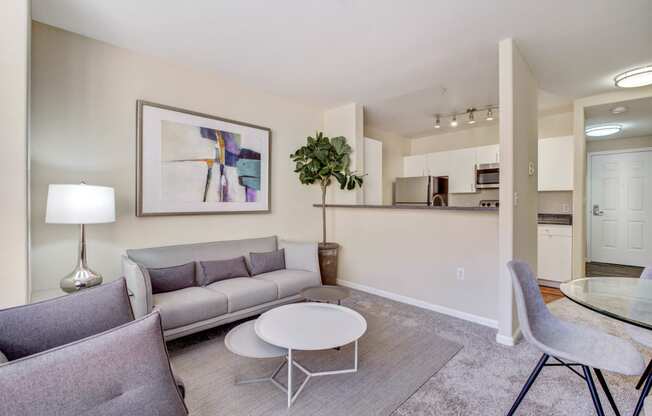 living room with kitchen island connecting to living room and kitchen