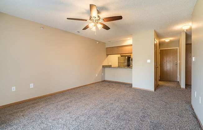 large living room with kitchen bar at Skyline View Apartments in Lincoln NE