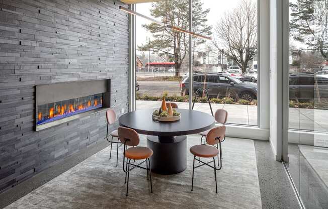 Northpointe Apartments Clubhouse Seating Area by Indoor Fireplace