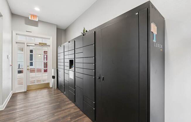 A black locker with the word LUXEER on it.