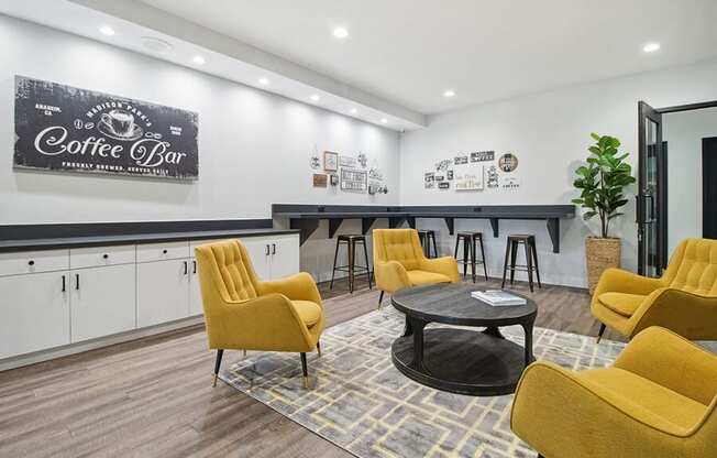 Community Clubhouse with Lounge Furniture at Madison Park Apartments located in Anaheim, CA.