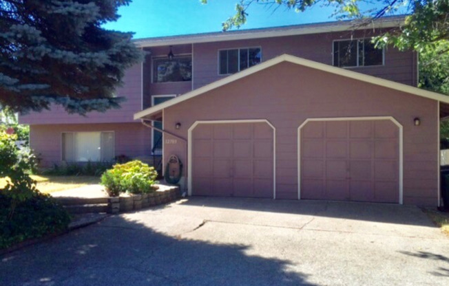 Spacious 4 Bed 3 Bath Kirkland Home with Attached Garage and Large Yard!