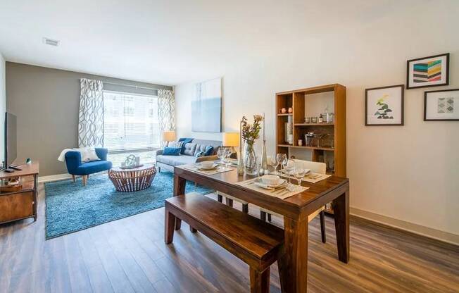 A dining room with a wooden table and bench.