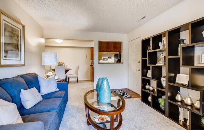 a living room filled with furniture and a fireplace